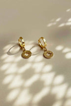 Star Huggie earrings