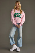 Oversized pink sweatshirt featuring statement “APRÈS” lettering and a relaxed casual silhouette.