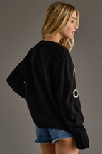 Whiskey Weather sweater in classic black with a bold contrasting slogan knit and relaxed fit.
