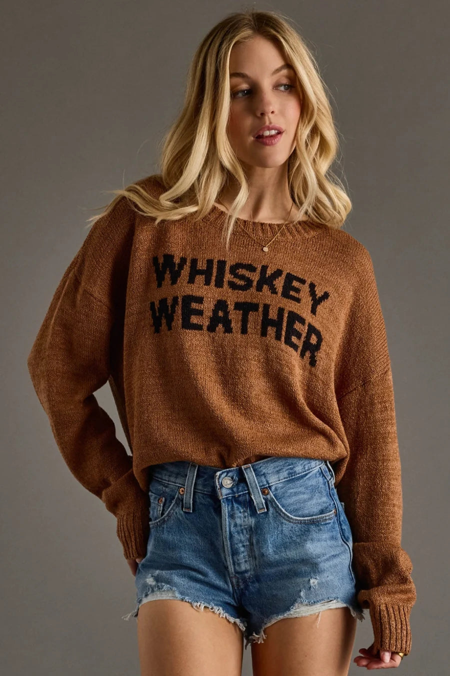 Whiskey Weather lightweight sweater in tobacco brown with a bold black slogan knit and relaxed fit.
