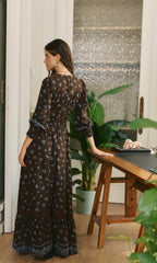 Jaase Juniper maxi dress with a bohemian-inspired print, flattering V-neck and elegant floor-length shape.