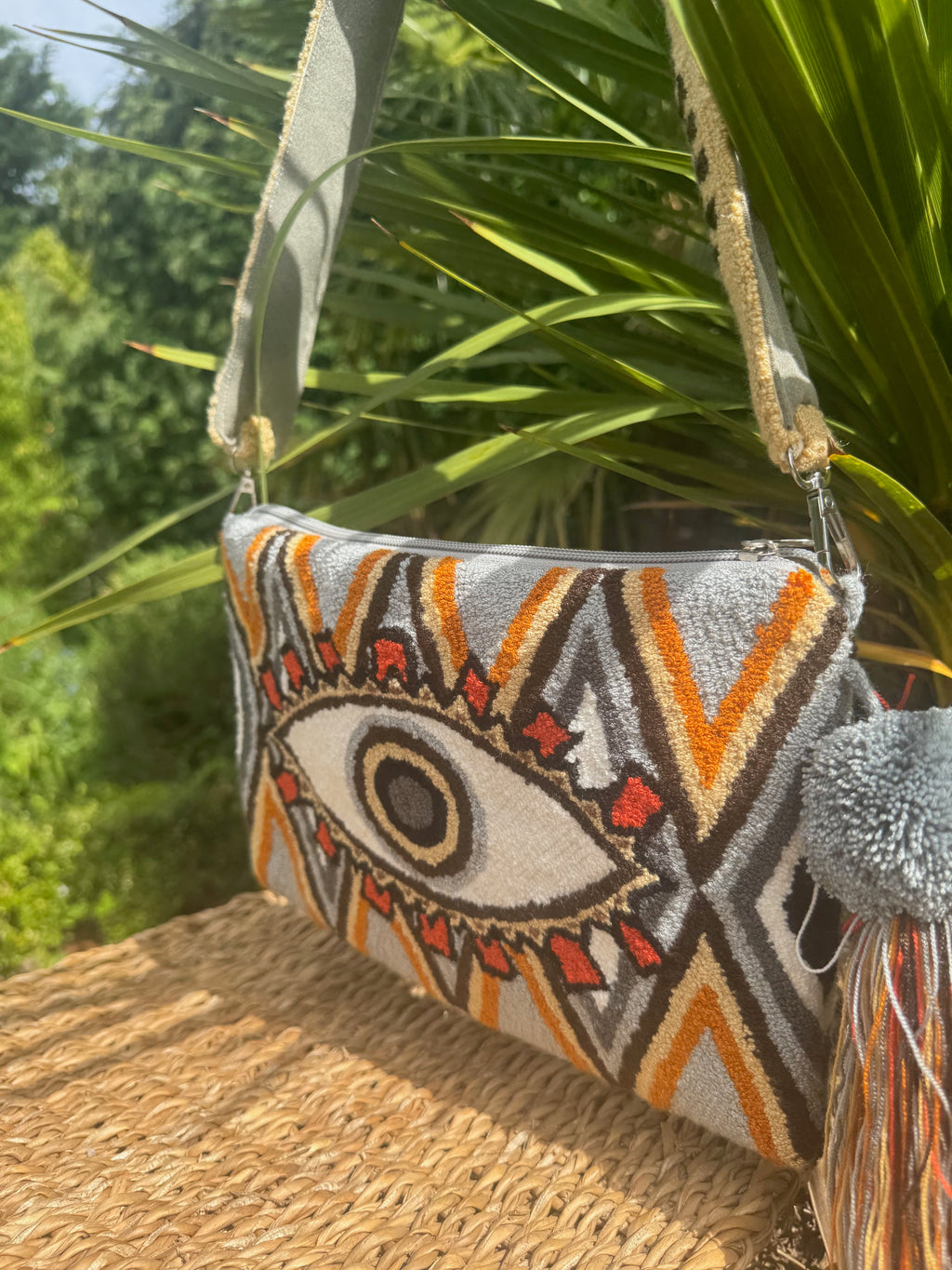 MULTICOLOUR EYE CLUTCH WITH MATCHING STRAP