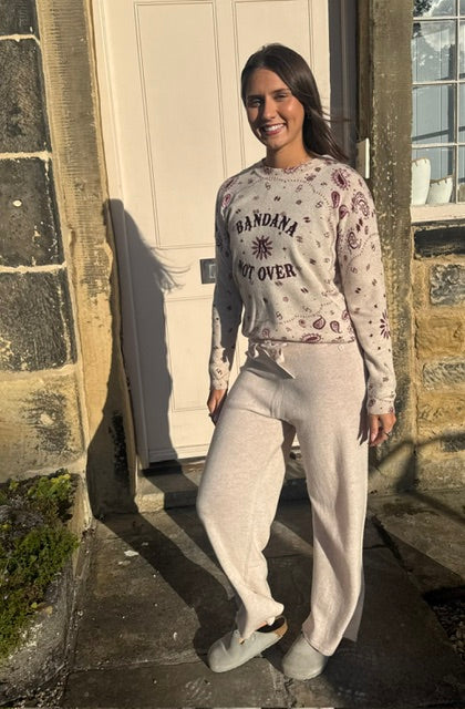 Woman wearing sable wool knit trousers with relaxed fit