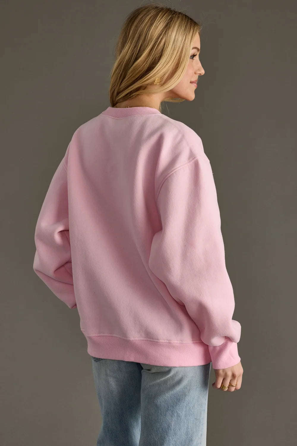 Pink Après pullover with varsity-inspired detailing, soft relaxed fit and ribbed trims.