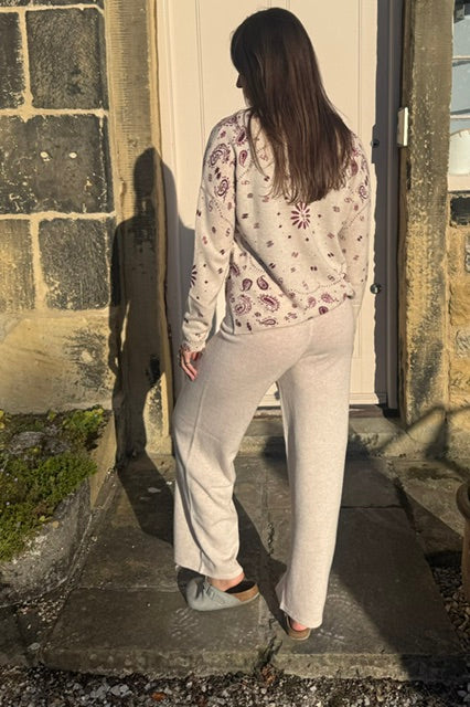 Woman wearing sable wool knit trousers with relaxed fit back