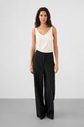 Wide leg stretch trousers styled with a fitted knit and heels