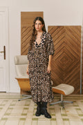 Sabrina Maxi Dress by Jaase featuring an Untamed leopard print, long balloon sleeves and a stretch smocked waist.