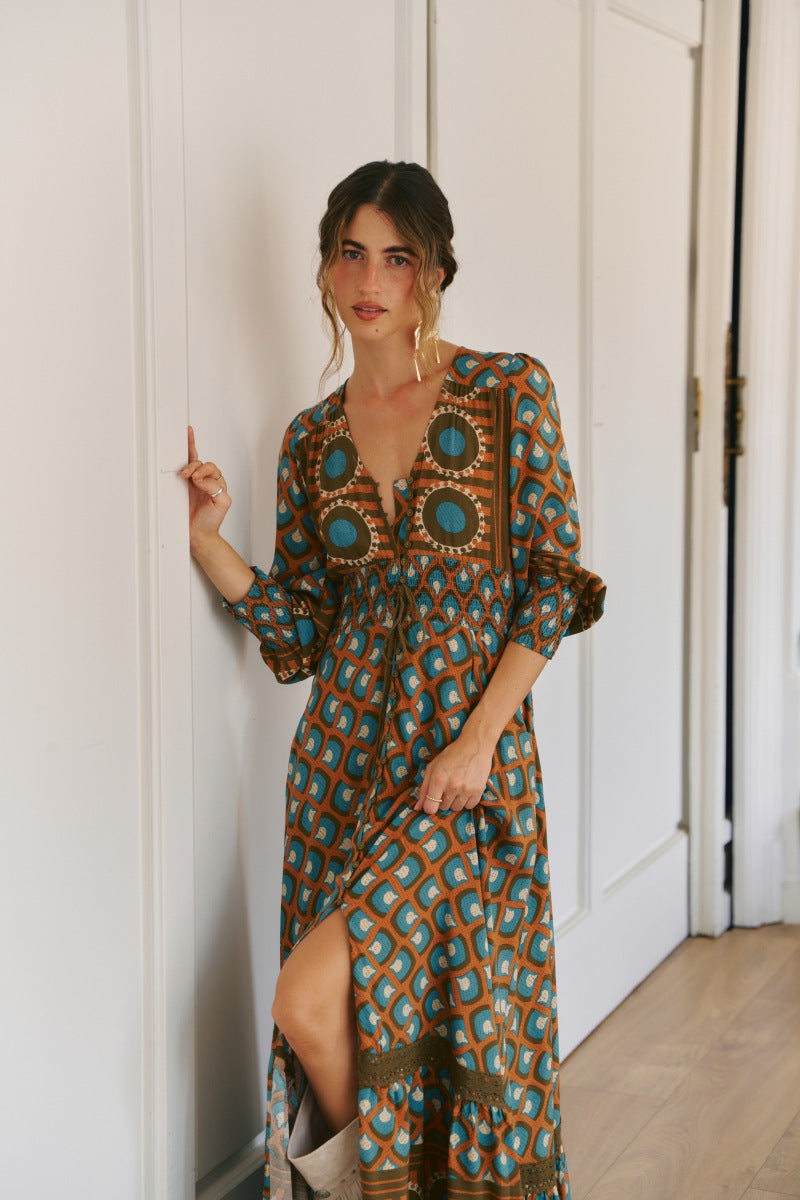 Jaase Bianca Print Sabrina Maxi Dress featuring a bold geometric print in teal, rust, brown and cream tones.