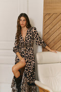 Statement leopard print maxi dress by Jaase with a tiered skirt, smocked waist and sophisticated day-to-night styling.