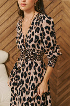 Jaase Untamed animal print dress with a feminine V-neck, gathered cuffs and softly draped maxi silhouette.