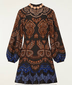 Women's black long sleeve mini dress with copper and gold baroque print and balloon sleeves