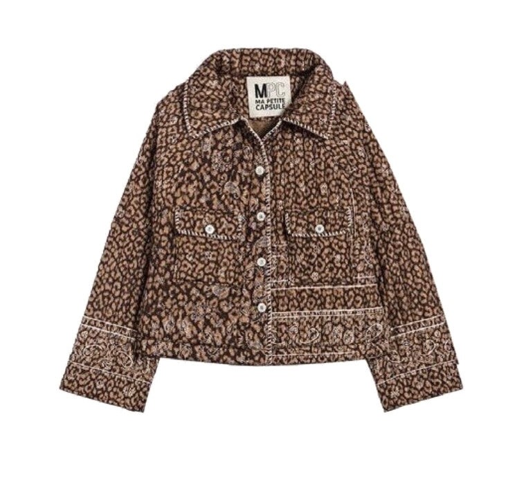 A cropped brown and beige animal print jacket with white contrast stitching and silver-tone snap buttons, shown flat on a white background. The brand label inside the collar reads 'M MONTY CAMPA'.